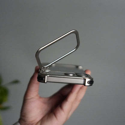 iPhone 17 Pro 9-Shaped Frameless Metal Bumper Case with Hidden Lens Stand | Shockproof Aviation-Grade Alloy Frame